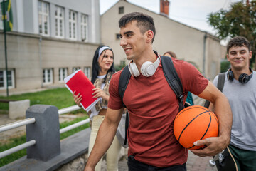 group of teenage students gen z walk in front of school university