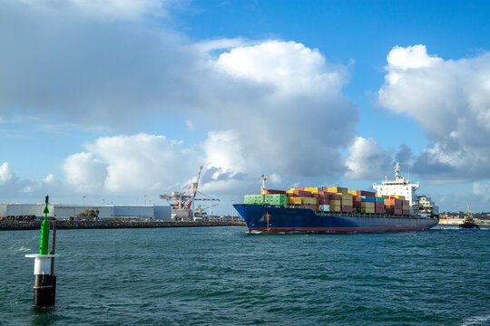 Blue hulled container ship departing Port of Fremantle.