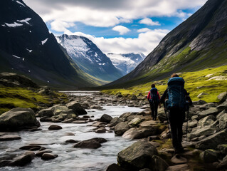 Fototapeta premium Two friends hiking in the mountains with an amazing view. Concept of wandering and exploring the outdoors. Shallow field of view.