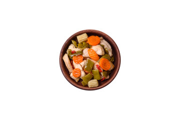 Delicious chicken slices and steamed vegetables carrots, broccoli, asparagus beans