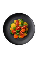 Salad of fresh and steamed vegetables cherry tomatoes, broccoli and carrots