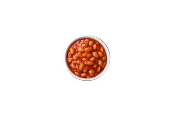 Delicious canned beans in a tomato in a white ceramic bowl