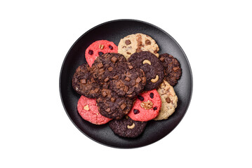 Delicious fresh crispy oatmeal cookies with chocolate and nuts