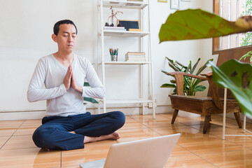 Meditation, zen asian man in relax, peace and mental health in house living room