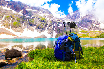 hiking equipment with lake and mountain view