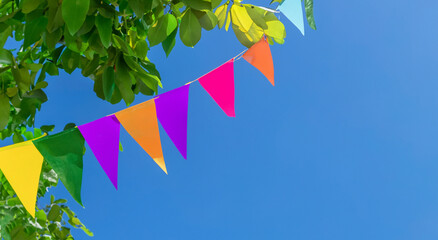 beautiful multi-colored pennants hung outdoors
