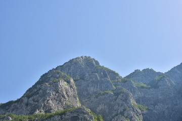 Summer day mountain landscape with blue sky and copy space for travel text.