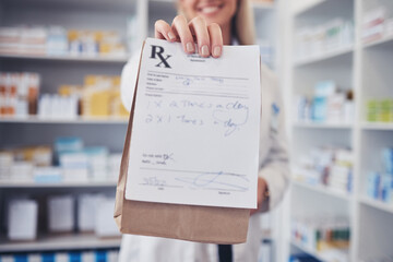 Woman, pharmacist and hand with paper bag for prescription, note or doctor certificate at pharmacy. Closeup of female person or medical professional giving medication or pharmaceutical at drugstore - obrazy, fototapety, plakaty