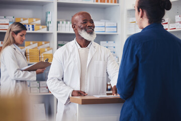 Pharmacy customer, happy and mature pharmacist help client with shop service, medicine support or...