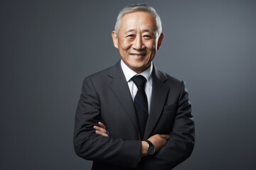 portrait of old businessman in smile in studio shoot 