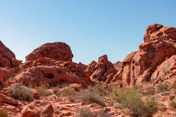 Scenic view of beehives red sandstone rock formations in Petroglyph Canyon on Mouse Tank hiking trail in Valley of Fire State Park, Mojave desert, Nevada, USA. Holes formed by geologic cross bedding