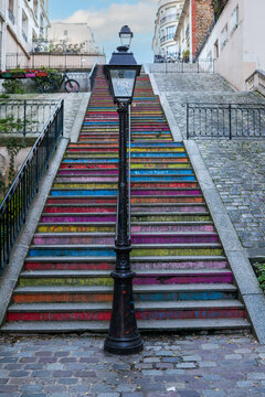 Colorful steps from a street in Montmartre leading up to the Basilica of the Sacred Heart of Paris.