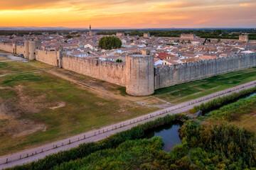 The ramparts and towers of historical Aigues-Mortes town in Camargue region, France - obrazy, fototapety, plakaty