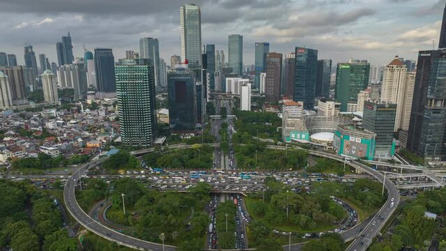 day time jakarta city downtown traffic street road junction aerial panorama 4k timelapse indonesia