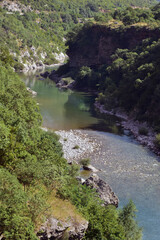 Sunny day in canyon Moraca, Montenegro. River and deep canyon. Nature scenery.