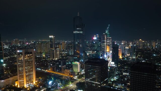 flight over jakarta city center night time illumination aerial panorama 4k timelapse indonesia