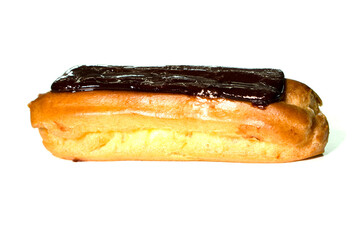 Tasty eclairs covered with chocolate on white background