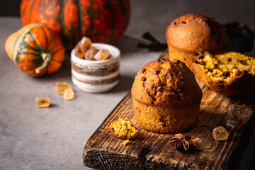 Homemade autumn pumpkin muffins with cinnamon and chocolate