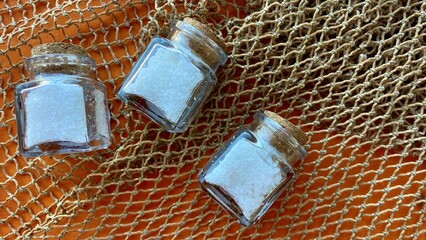 three small jars of salt