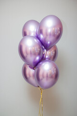 bunch of purple chrome balloons in the room