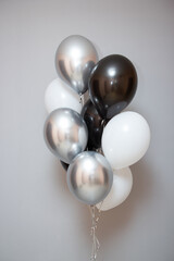 black and white birthday balloons