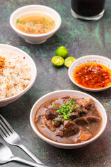 Pares, also known as beef pares, is a term for a serving of Filipino braised beef stew with garlic fried rice, and a bowl of clear soup. 
