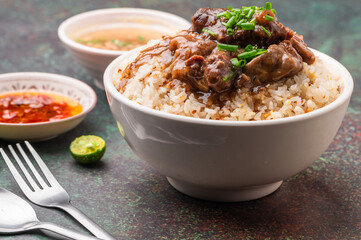 Pares, also known as beef pares, is a term for a serving of Filipino braised beef stew with garlic fried rice, and a bowl of clear soup. (Pares rice topping)