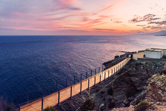 Hanging footbridge of Jolucar, with the Mediterranean Sea in the background at sunset, Granada coast.