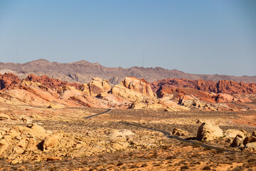 Panoramic view of endless winding empty Mouse tank road in Valley of Fire State Park through...