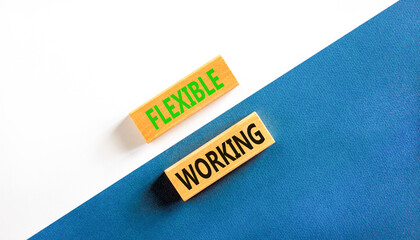 Flexible working symbol. Concept words Flexible working on beautiful wooden blocks. Beautiful white and blue background. Business flexible working concept. Copy space.