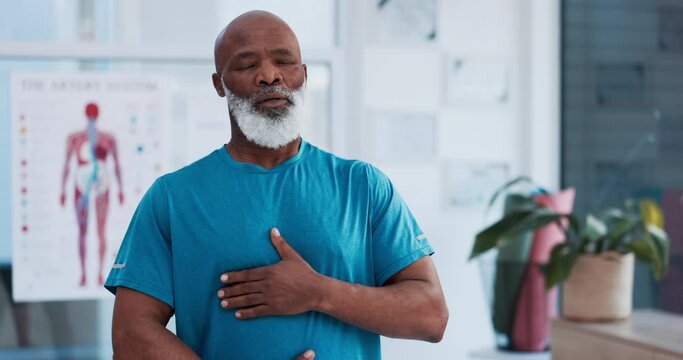 Exercise, meditation and breathing with a senior black man in a physiotherapy office for training or wellness. Fitness, workout and inhale with an elderly patient in a clinic for physical therapy
