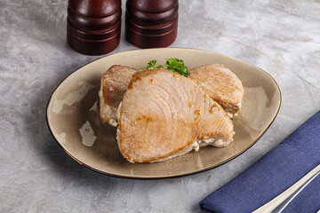Roasted red tuna steak in the plate
