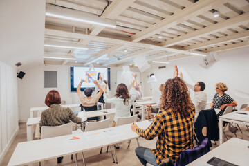 Businesspeople throwing their exams in the air celebrating