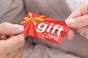 Businessperson Hands Giving Gift Card To Other Businessperson