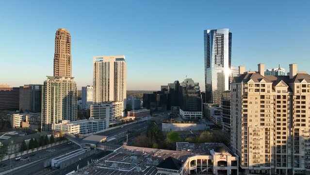 Amazing 4K aerial drone footage of Buckhead's Atlanta's modern skyline. Pan footage showcases modern skyscrapers and urban cityscape.