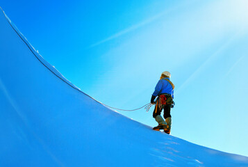 A climber reaches the summit of Everest in Nepal - 639695505