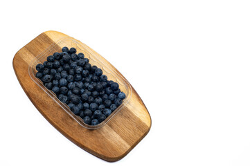 fresh blueberries from the home garden displayed on a wooden board