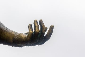 Dripping bronze statue hand