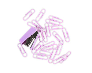 Colorful paper clips and stapler on white background