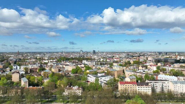 Aerial Riga top view famous Riga's Historic city Latvia in panoramatic spring season panorama sunrise blue sky clouds skyscrapers. Beautiful modern historical buildings monuments architecture houses