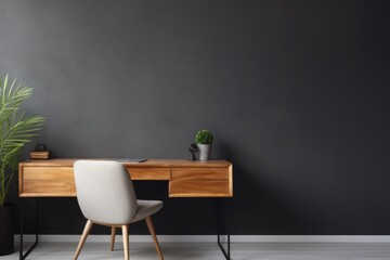 Workplace with white chair at wooden drawer writing desk against of window near dark grey wall Interior design of modern scandinavian home office