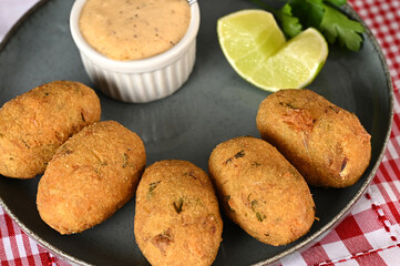 Fried codfish fritter typical Portuguese and Brazilian cuisine fish with herbs