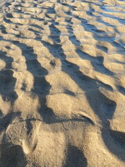Beach sand wave pattern created by wind and waves