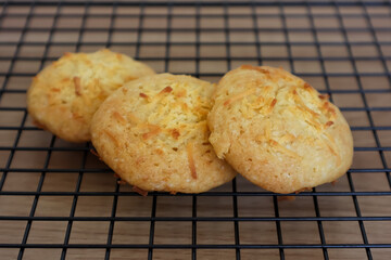 Homemade cheese baked cookies on the wire tray
