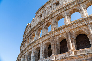 close up of Colosseum, Rome, Italy with blue summer sky behind it - Landscape 