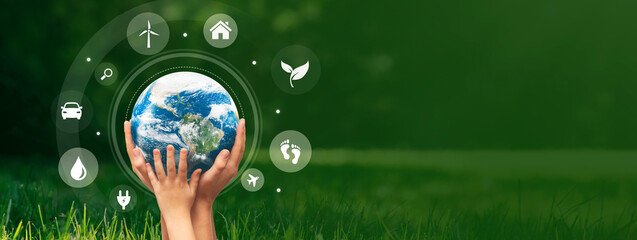 Earth care concept with hands holding globe. Elements of this image furnished by NASA.