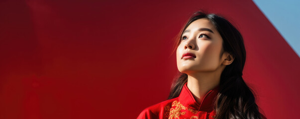 Obraz premium A young Asian woman looks upwards ecstatically as she takes part in a traditional H courtship ritual during a New Year celebration.
