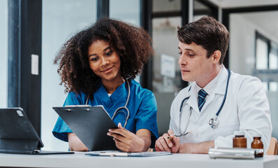 Medical staff team african american meeting discussing chest x-ray film Radiologists medical...