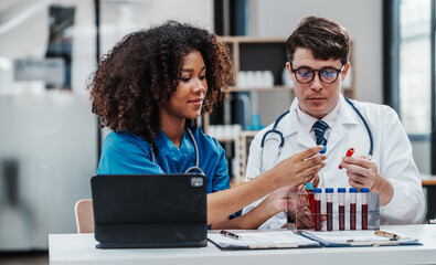 Team meeting lab assistant african american people holding test tube with blood sample research and development of antiretroviral drugs, diabetes, osteoporosis, Monkeypox, Anxiety Disorder © NanSan