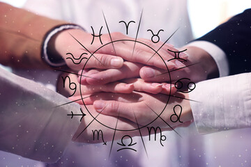 Relationships and horoscope. Zodiac wheel and photo of people joining hands together, closeup